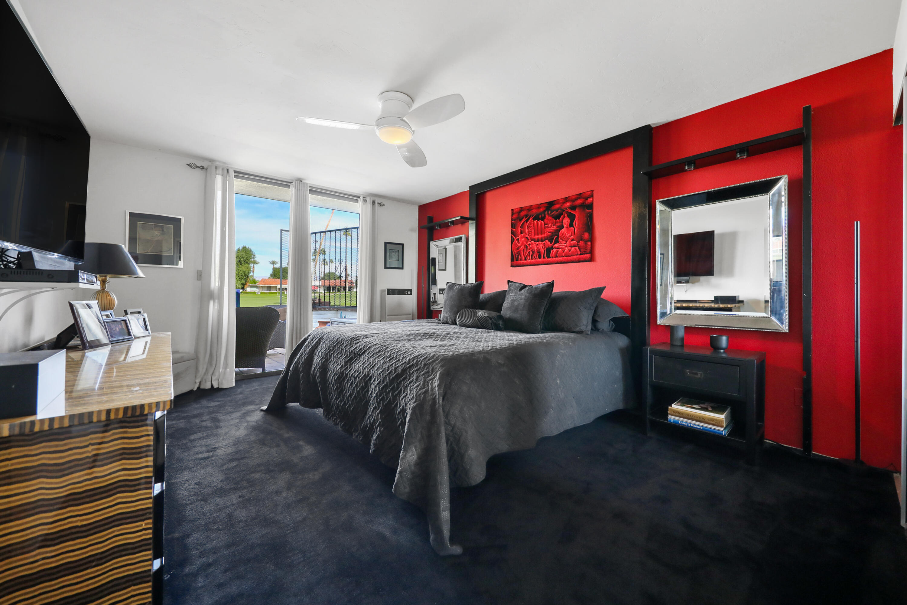 38 San Sebastian Drive Rancho Mirage, CA 92270 - Photo 23 of 45 a bedroom with a bed and a flat screen tv