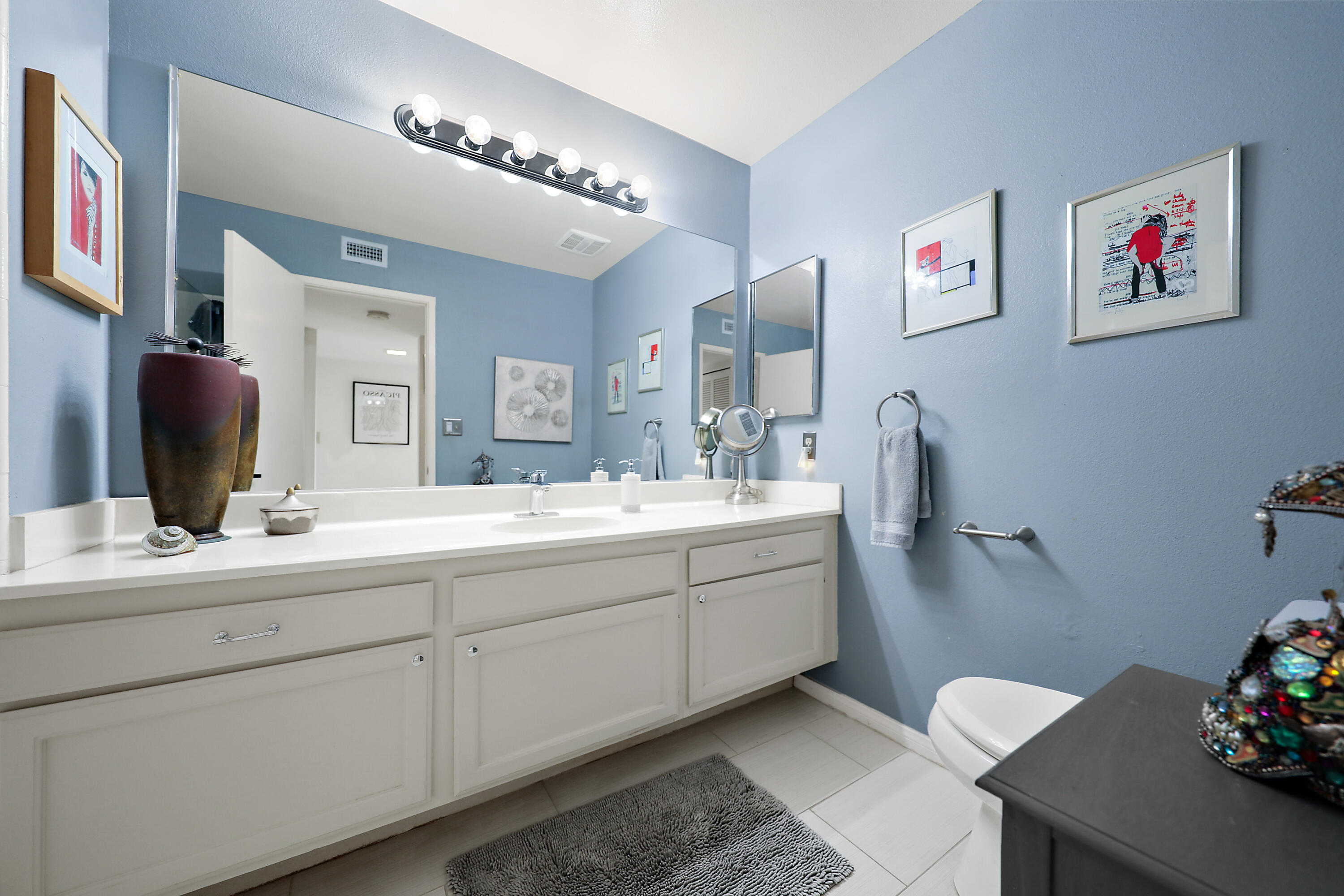 38 San Sebastian Drive Rancho Mirage, CA 92270 - Photo 29 of 45 a bathroom with a double vanity sink and a mirror