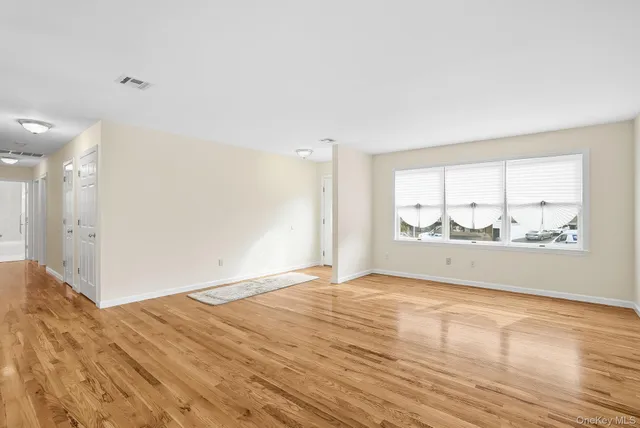 a view of an empty room and window