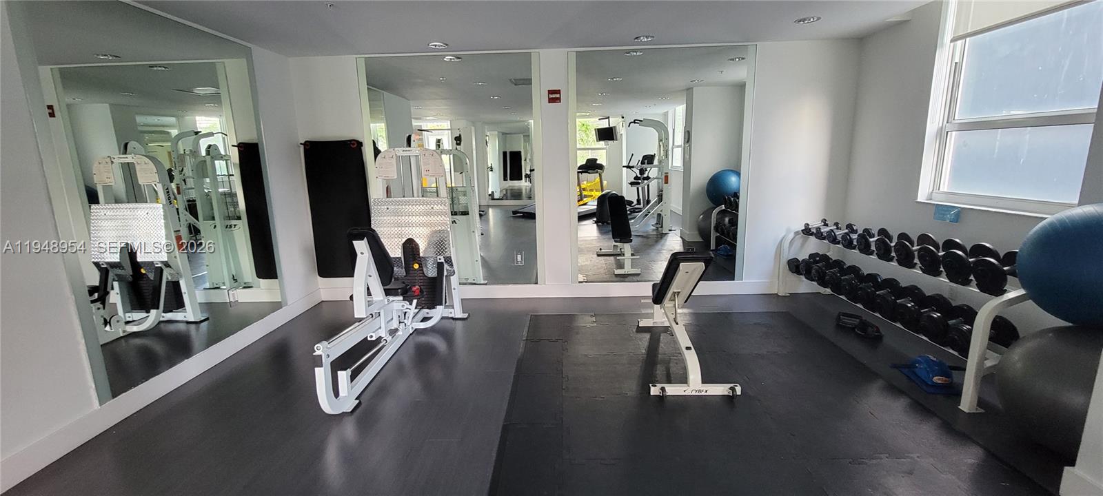 234 Northeast 3rd Street, Unit 1209 Miami, FL 33132 - Photo 12 of 12 a view of a room with gym equipment