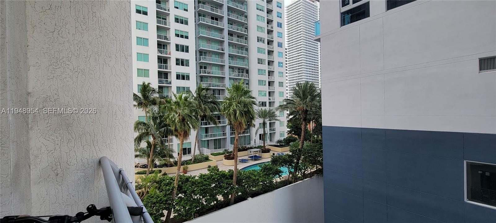 234 Northeast 3rd Street, Unit 1209 Miami, FL 33132 - Photo 7 of 12 a potted plant sitting in front of a bathroom