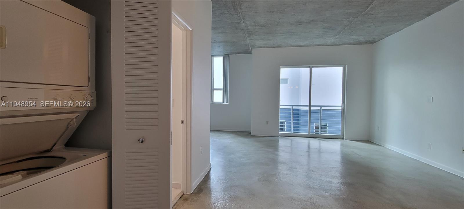 234 Northeast 3rd Street, Unit 1209 Miami, FL 33132 - Photo 9 of 12 a view of empty room with wooden floor