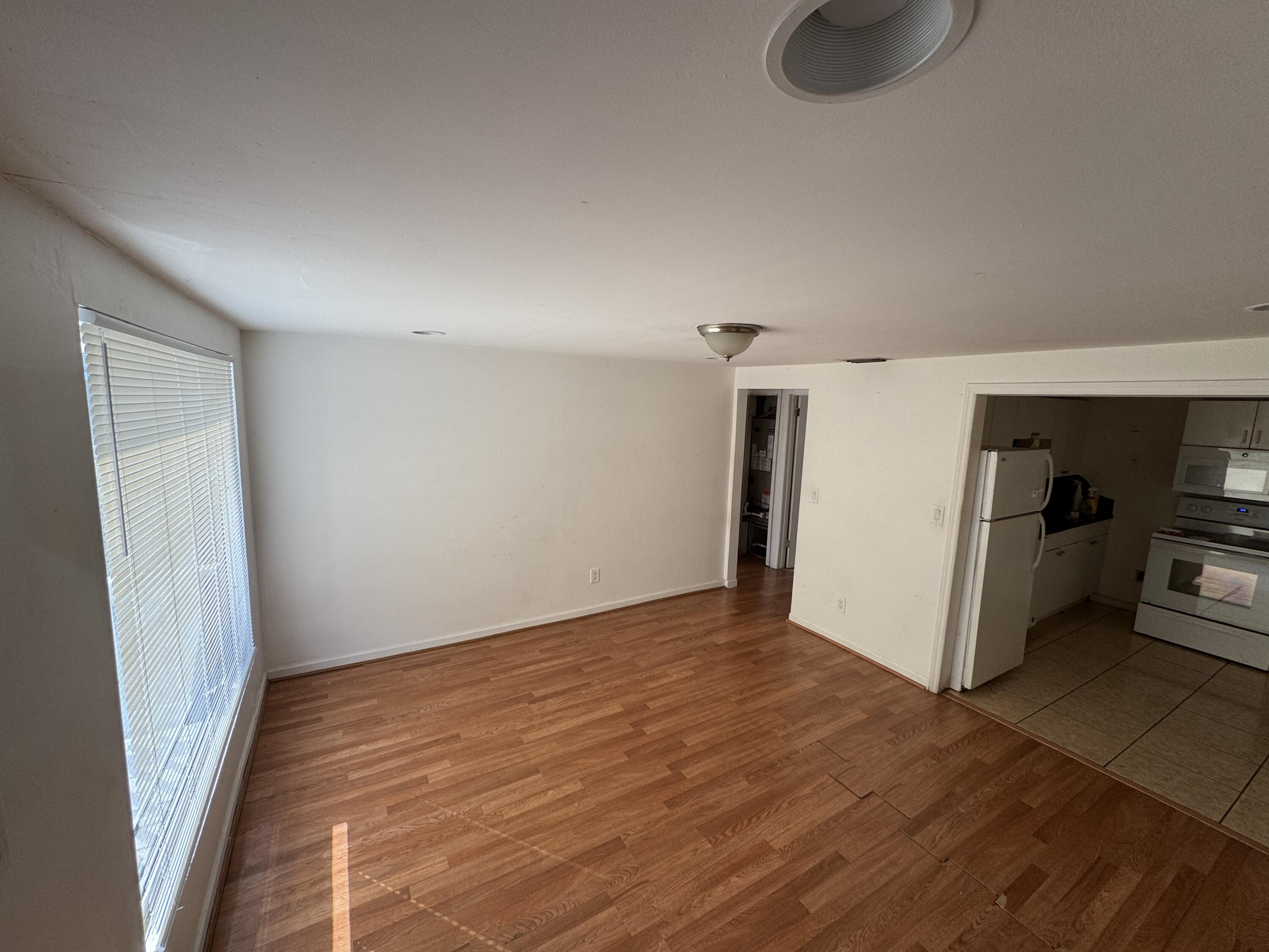 5645 Papaya Road Royal Palm Estates, FL 33413 - Photo 2 of 23 a view of a livingroom with wooden floor