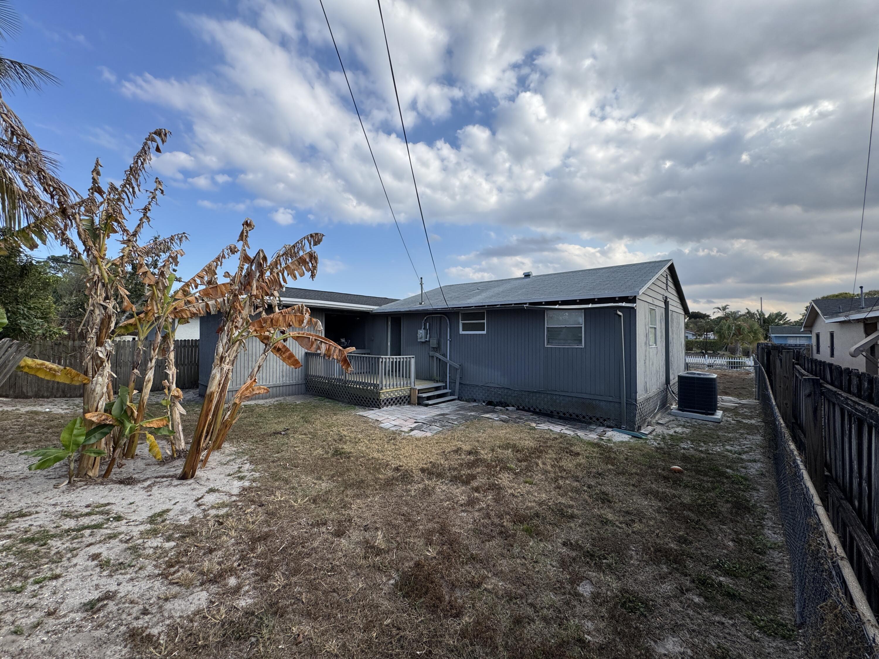 5645 Papaya Road Royal Palm Estates, FL 33413 - Photo 22 of 23 a view of a backyard