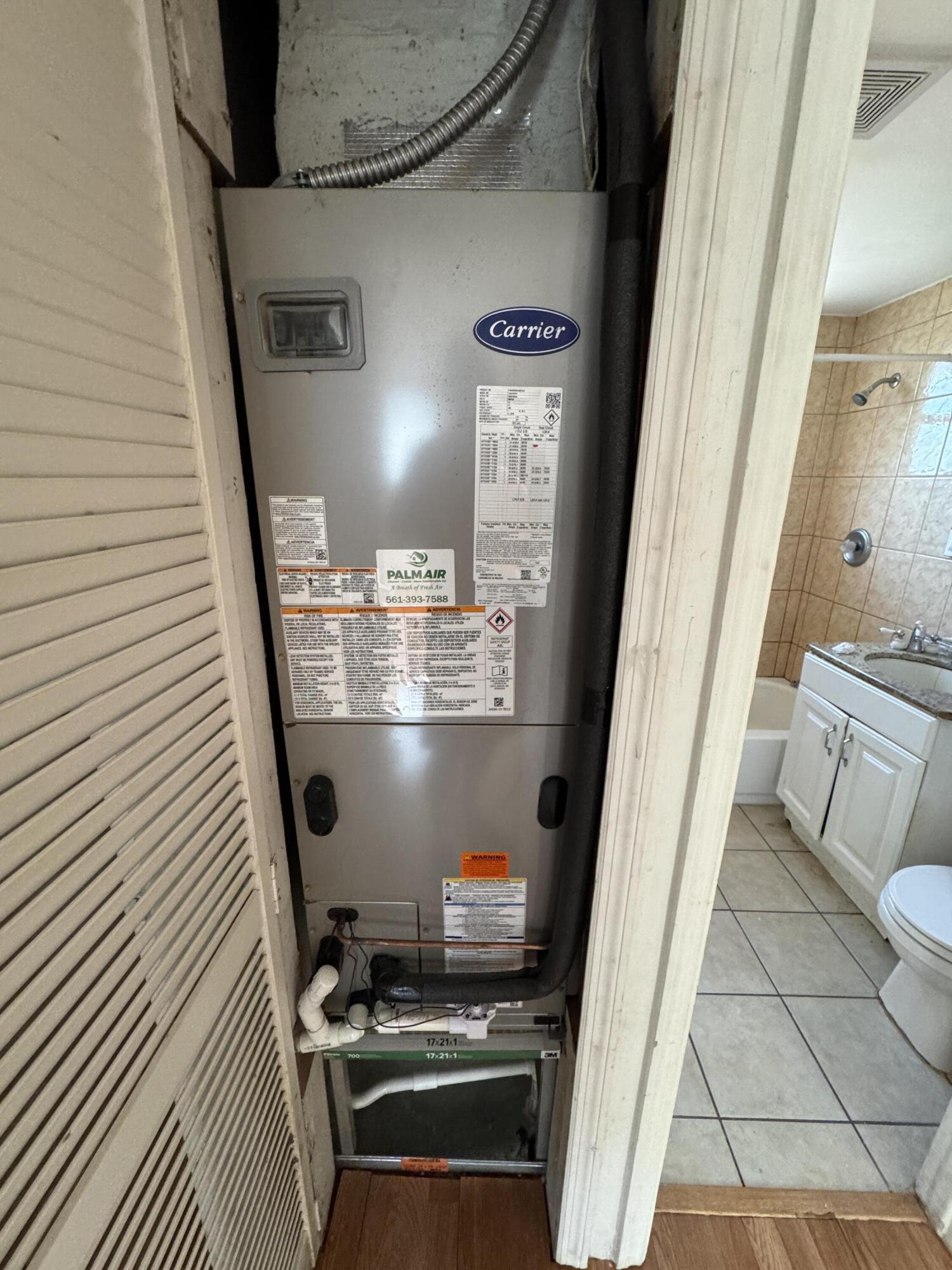 5645 Papaya Road Royal Palm Estates, FL 33413 - Photo 6 of 23 a view of kitchen and wooden floor