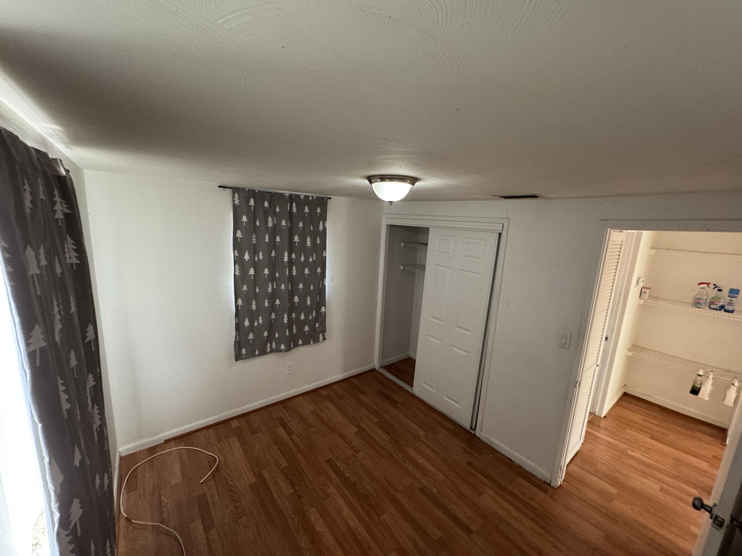 5645 Papaya Road Royal Palm Estates, FL 33413 - Photo 9 of 23 a view of an empty room and wooden floor