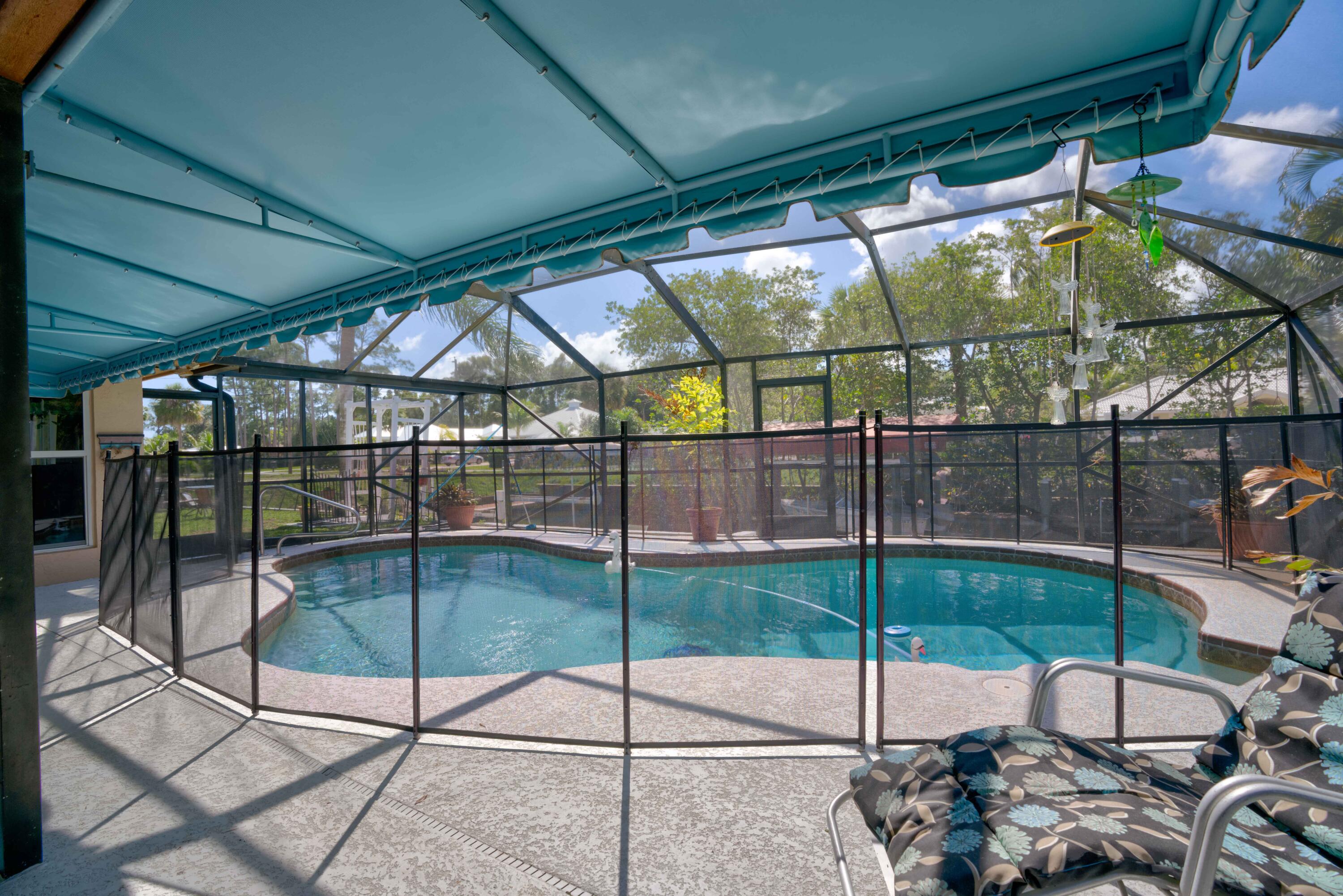 9524 Southeast Cove Point Street Jupiter, FL 33469 - Photo 6 of 58 Screened pool