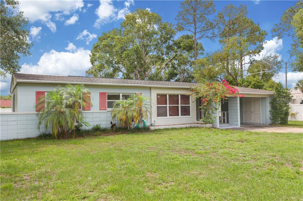 5341 Lake Howell Road Winter Park, FL 32792 - Photo 1 of 1 front view of a house with a garden