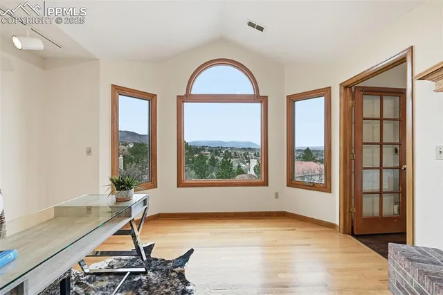 a view of a room with furniture and windows