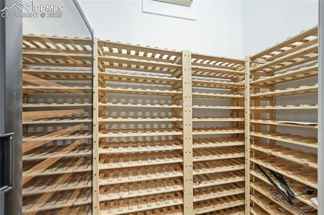 a bathroom with a granite countertop sink a toilet a mirror and shower