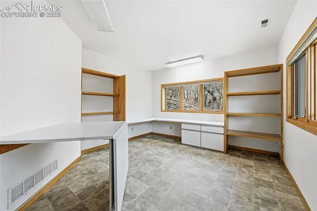 a view of a house with a yard and garden