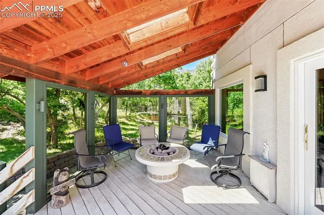 an aerial view of a house with yard and outdoor seating
