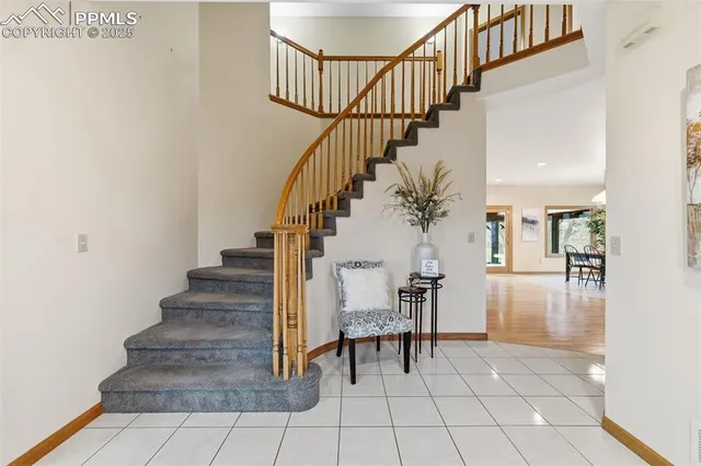 a view of entryway and hall with dining room