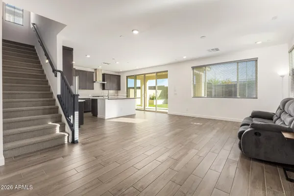 a living room with a couch and a dresser