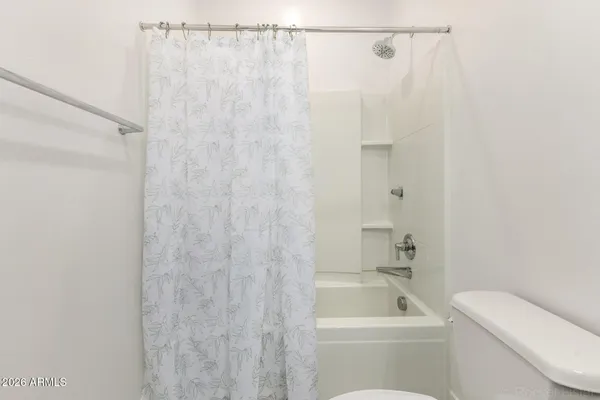 an empty room with closet area