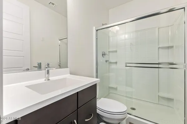 a bedroom with a bed and a cabinets
