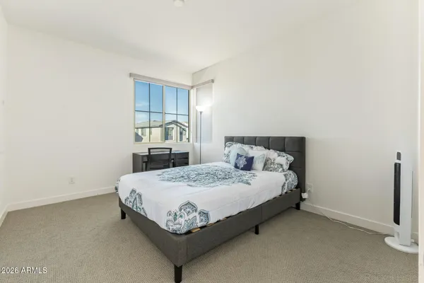 a room with a bed and a window