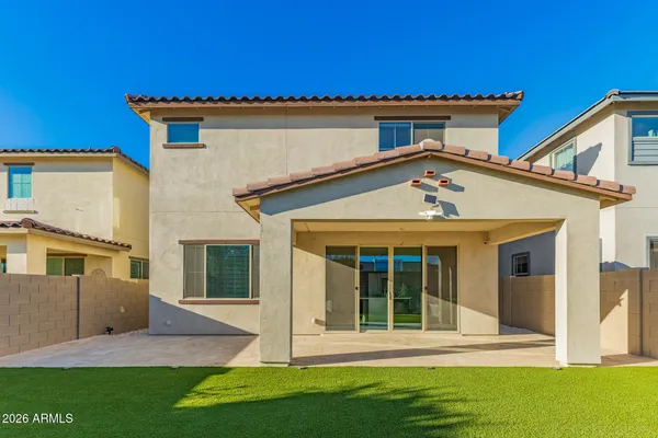 a front view of a house with a lake view