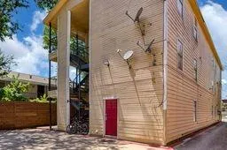 a view of a car parked in front of a house