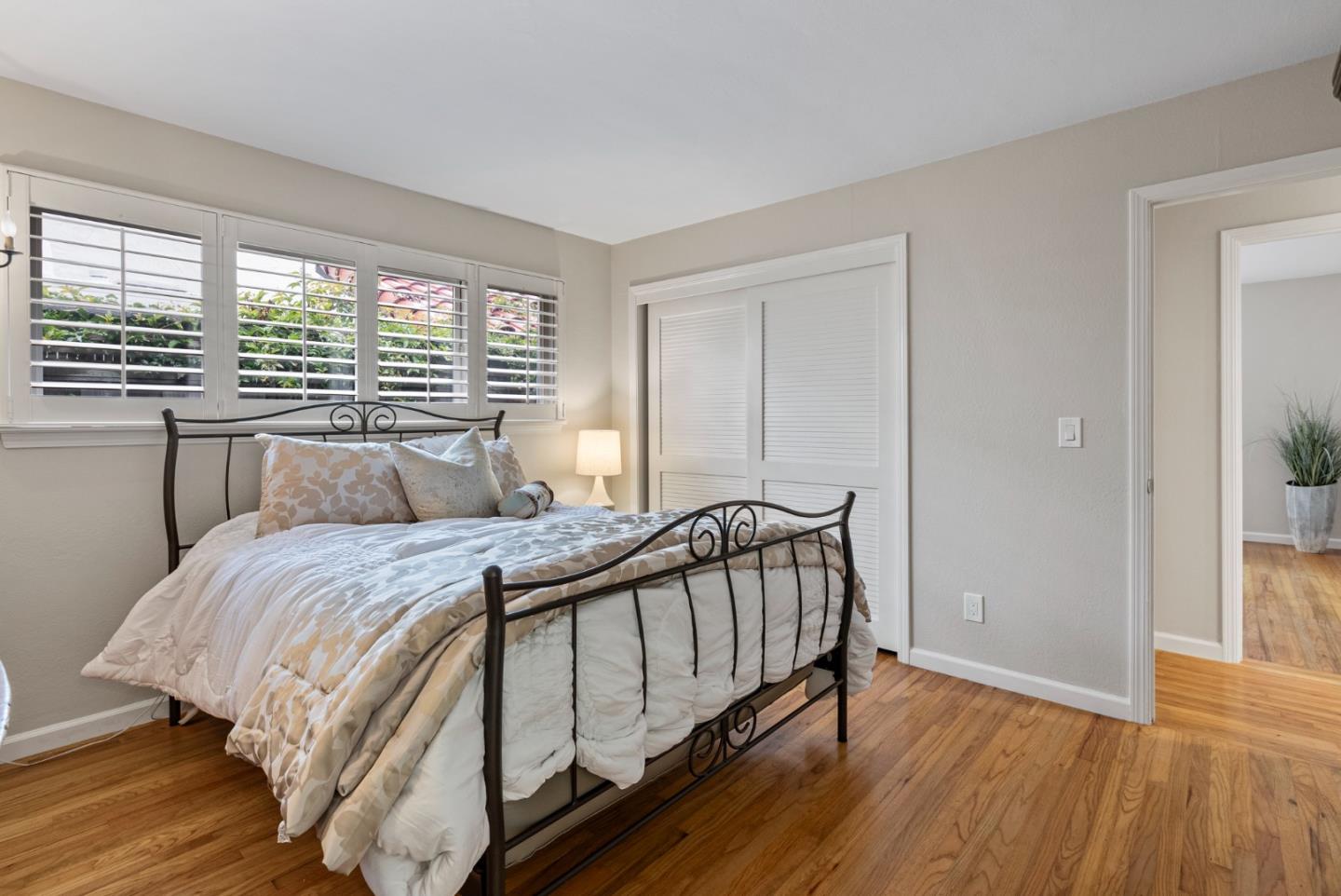 512 Cedar Street Aptos, CA 95003 - Photo 11 of 20 a bed sitting in a bedroom next to a window