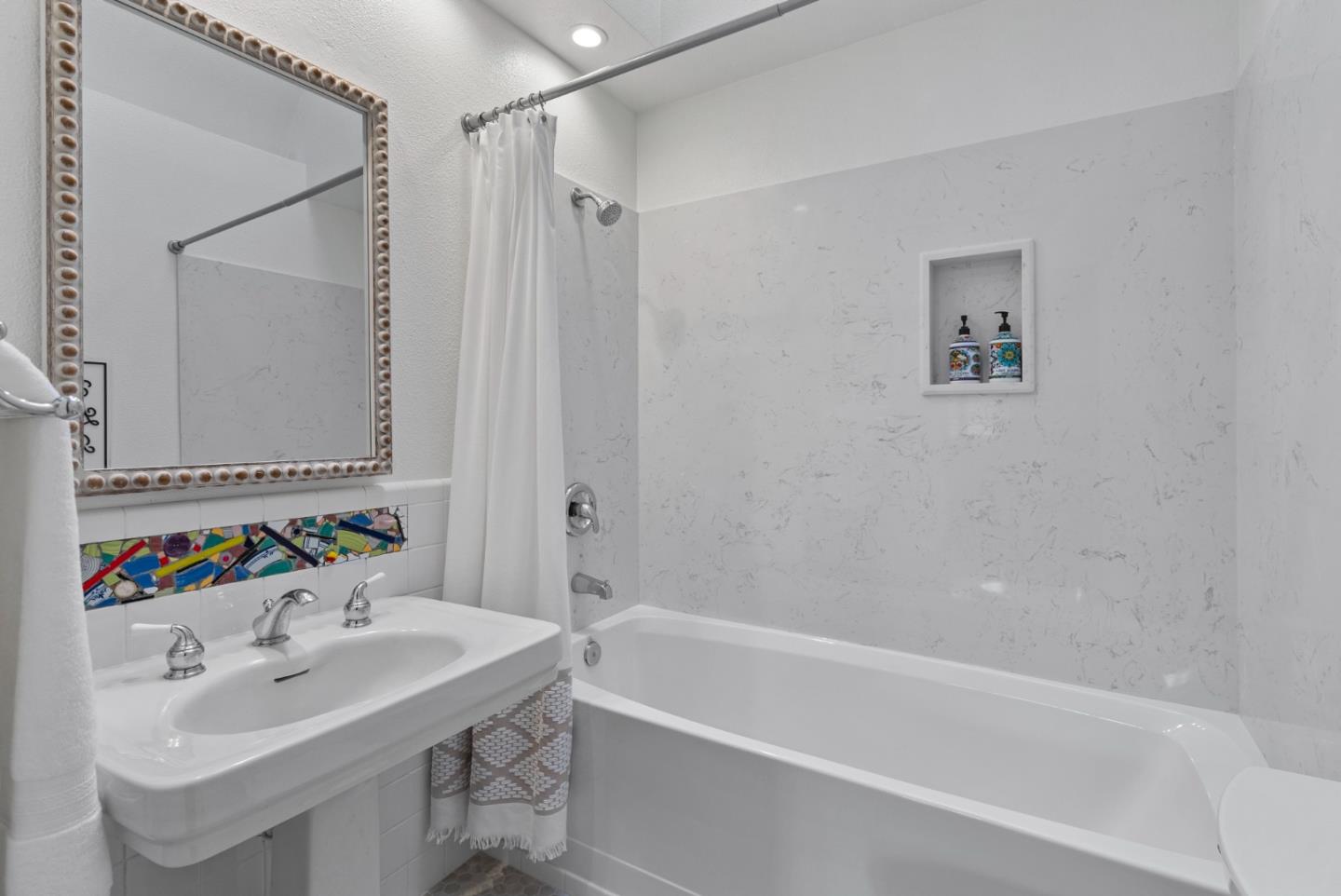 512 Cedar Street Aptos, CA 95003 - Photo 12 of 20 a bathroom with a sink and a bathtub