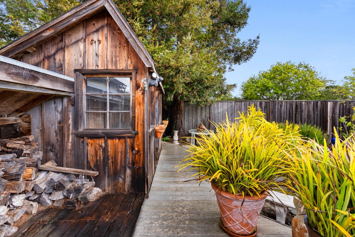 512 Cedar Street Aptos, CA 95003 - Photo 16 of 20 a view of a house with backyard and sitting area