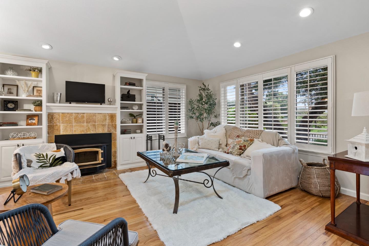 512 Cedar Street Aptos, CA 95003 - Photo 3 of 20 a living room with furniture a fireplace and a flat screen tv