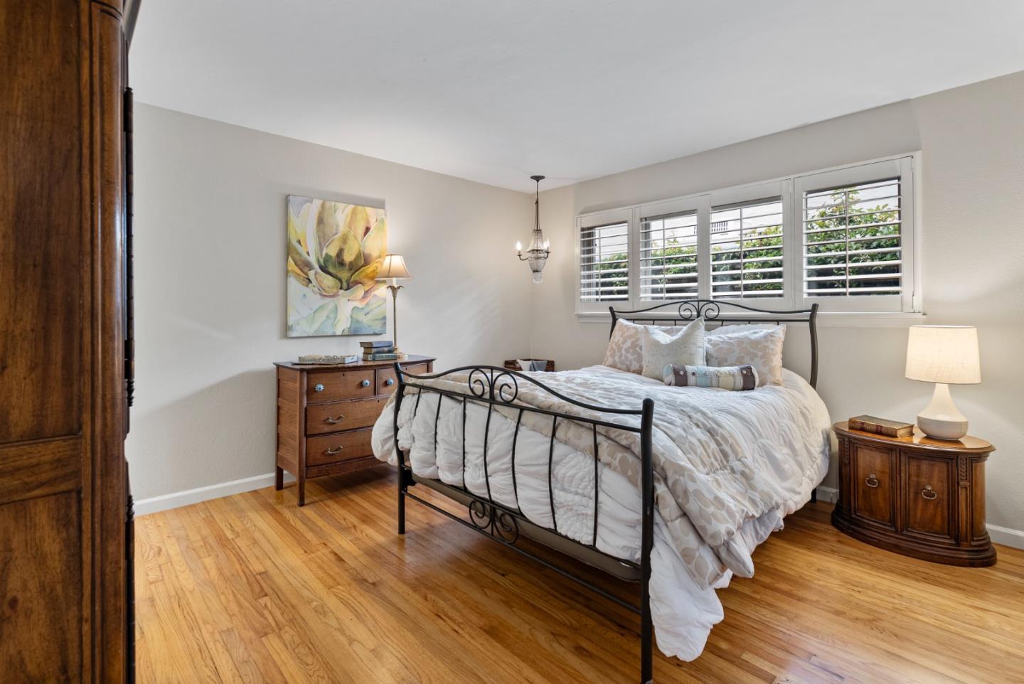 512 Cedar Street Aptos, CA 95003 - Photo 10 of 20 a bedroom with a bed and wooden floor