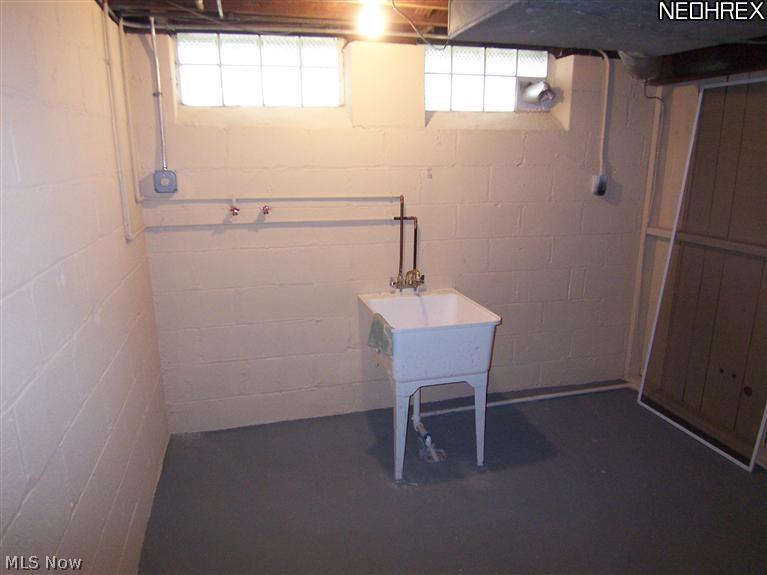 4089 Bushnell Road University Heights, OH 44121 - Photo 19 of 25 Laundry area wit new tub basin and hook ups for washer and dryer.