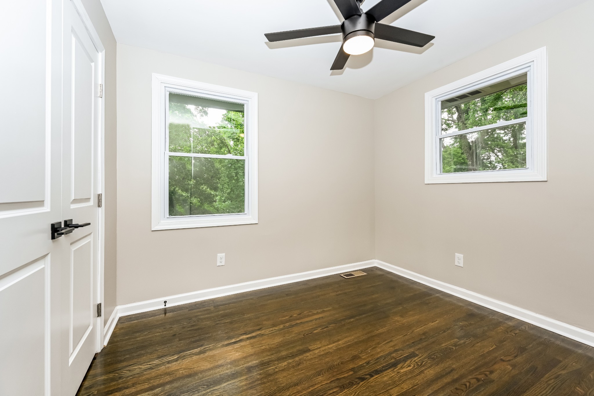 4932 Aquatic Road Nashville, TN 37211 - Photo 13 of 16 wooden floor in an empty room with a window