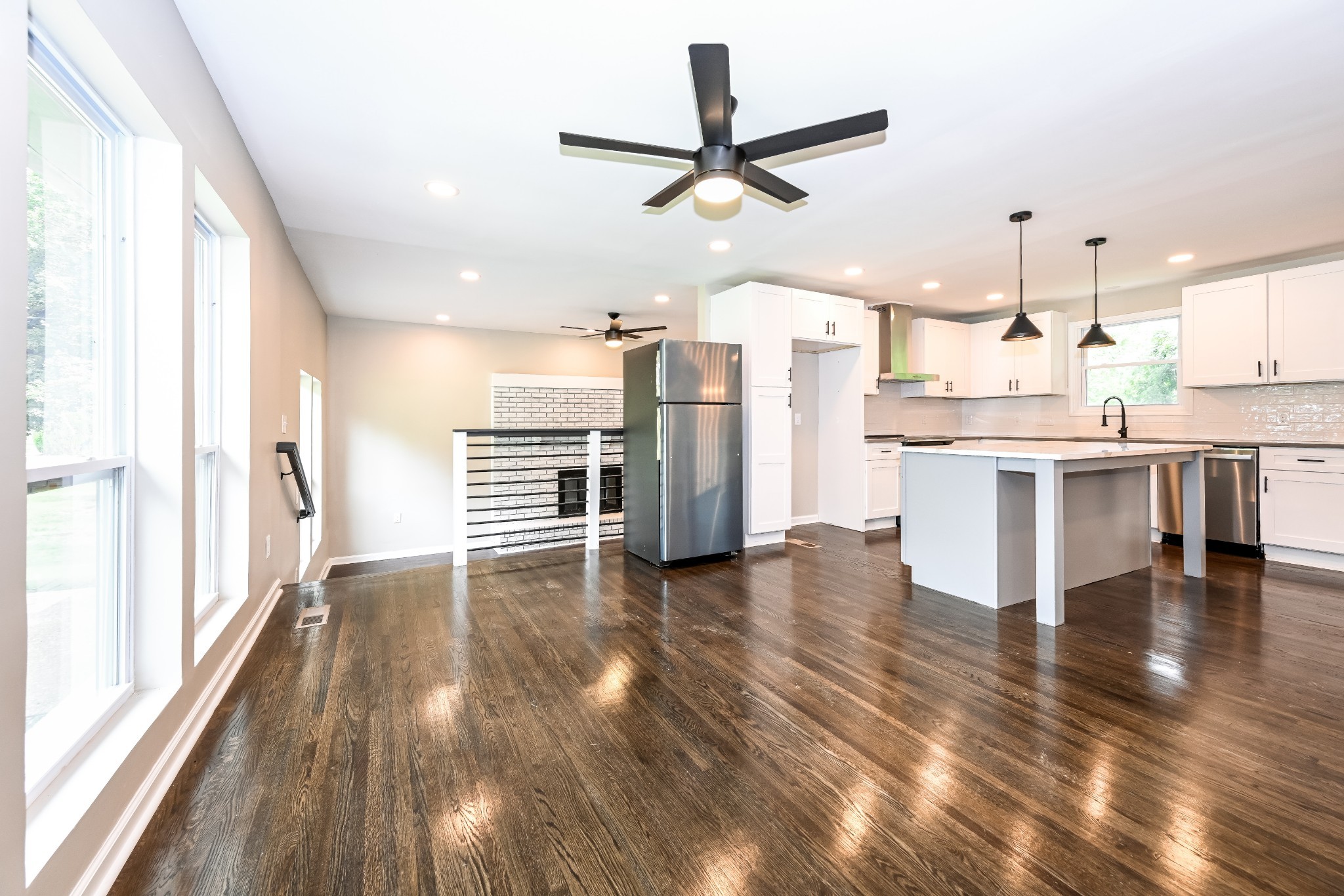 4932 Aquatic Road Nashville, TN 37211 - Photo 2 of 16 a view of a kitchen with a sink stove wooden floor and a window