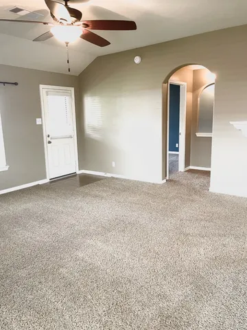 a view of an empty room and window