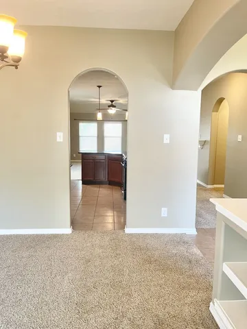 a view of a room with a fireplace and window