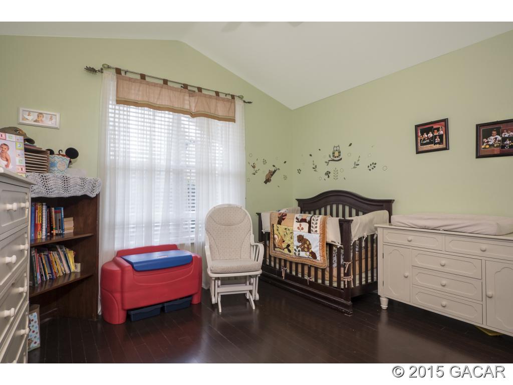 7610 Southwest 82nd Way Gainesville, FL 32608 - Photo 15 of 24 Guest BR w/Vaulted Ceiling