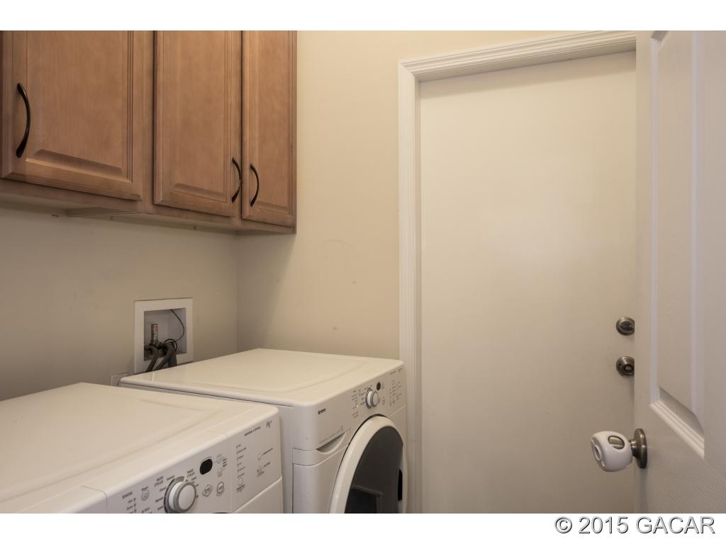 7610 Southwest 82nd Way Gainesville, FL 32608 - Photo 16 of 24 Laundry w/Upper Cabinets