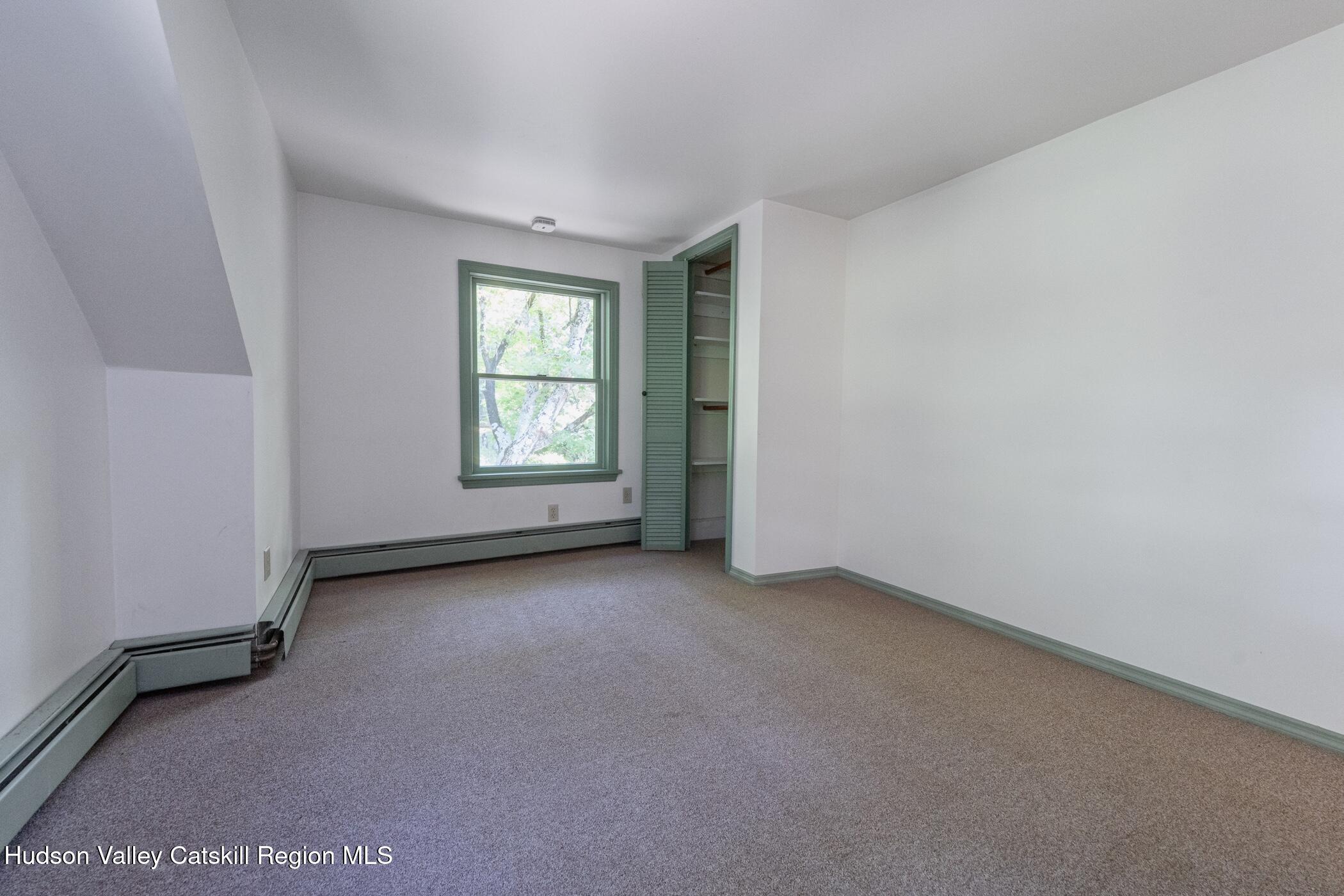 4533 Atwood Road Stone Ridge, NY 12484 - Photo 37 of 63 an empty room with windows