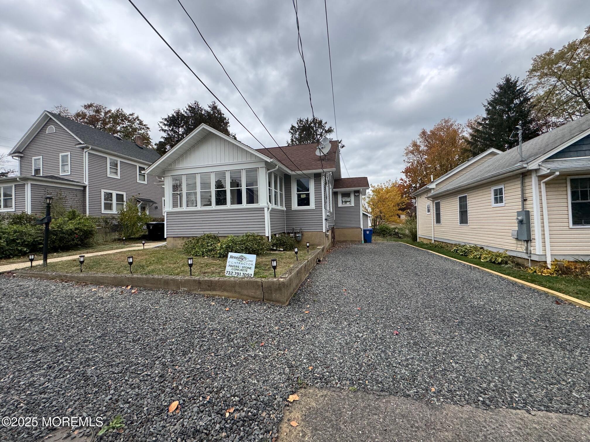 11 Washington Avenue, Unit 1 Leonardo, NJ 07737 - Photo 2 of 23 a front view of a house with a yard and garage