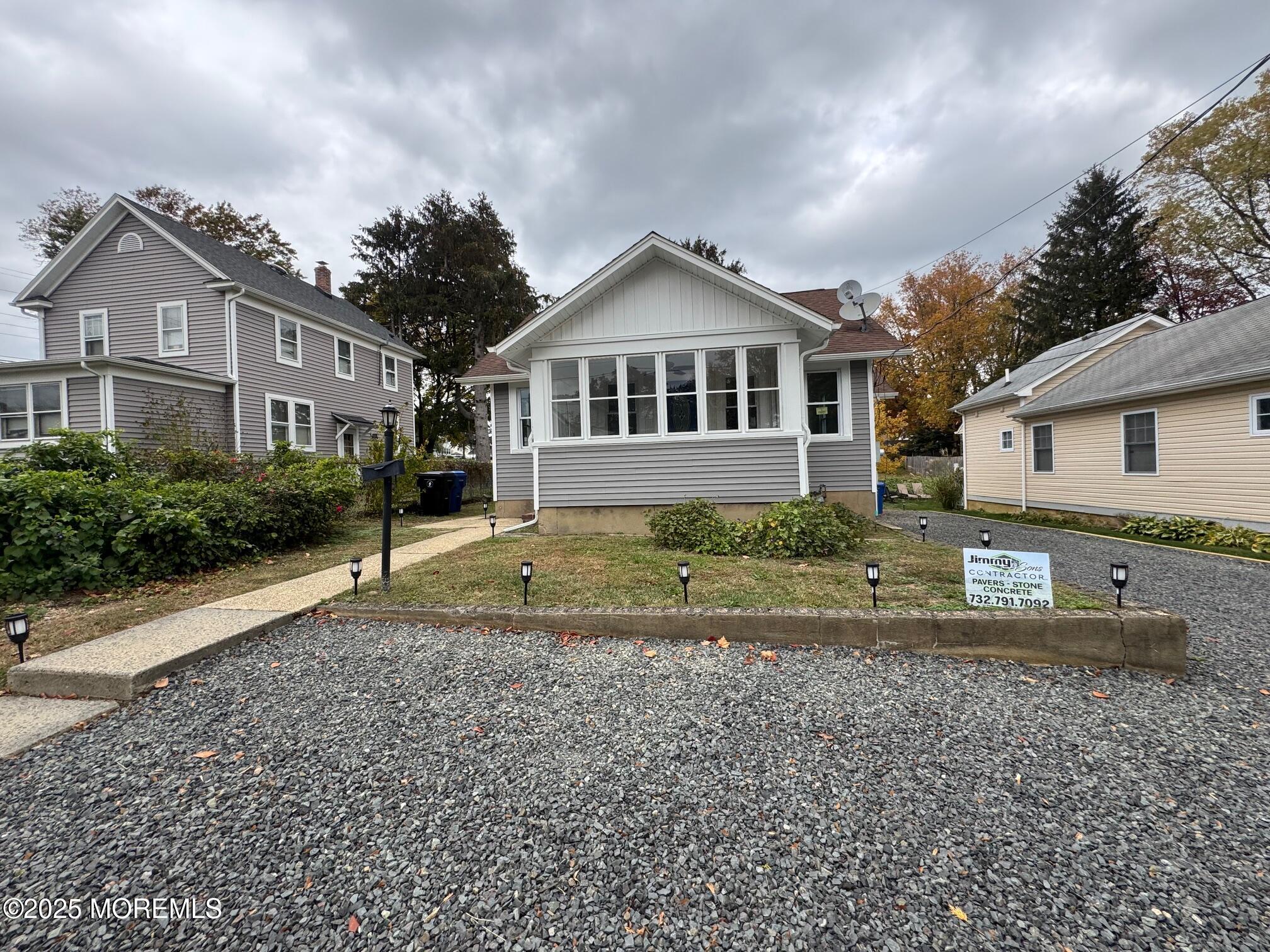 11 Washington Avenue, Unit 1 Leonardo, NJ 07737 - Photo 3 of 23 a front view of a house with a yard