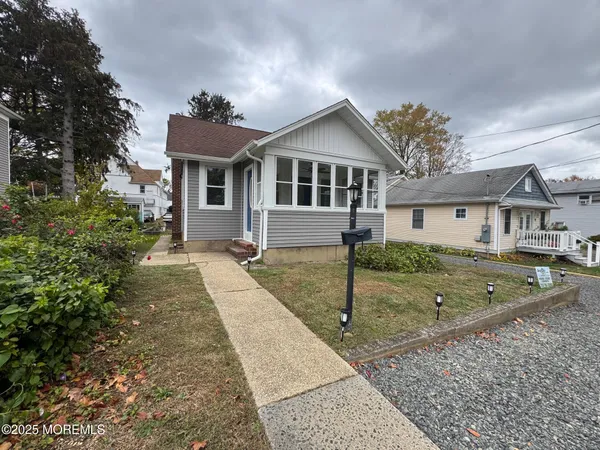 front view of a house with a yard