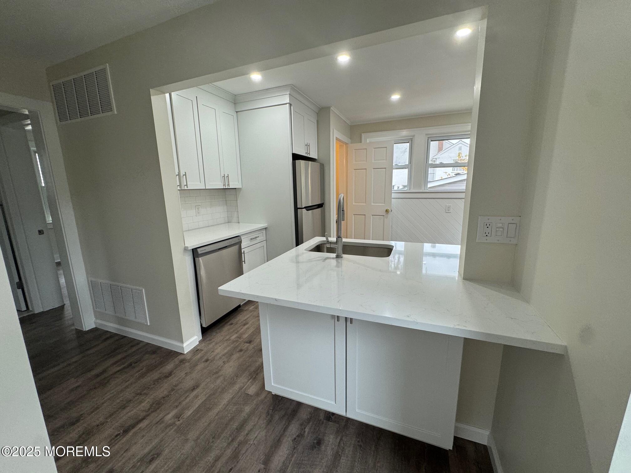 11 Washington Avenue, Unit 1 Leonardo, NJ 07737 - Photo 8 of 23 a bathroom with a sink a mirror and a shower