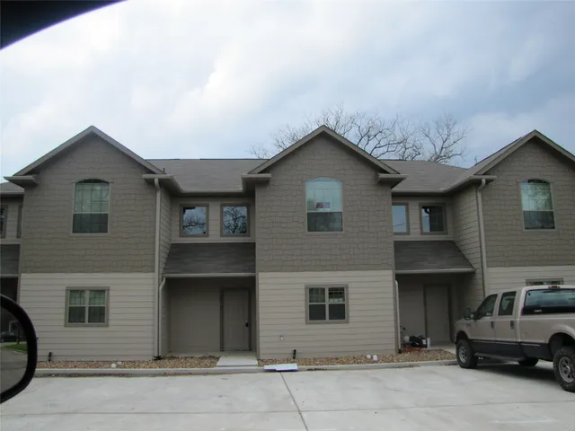 a front view of a house with a garage