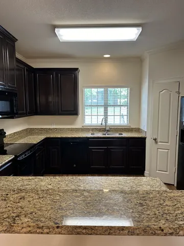 a bathroom with a bathtub and a window