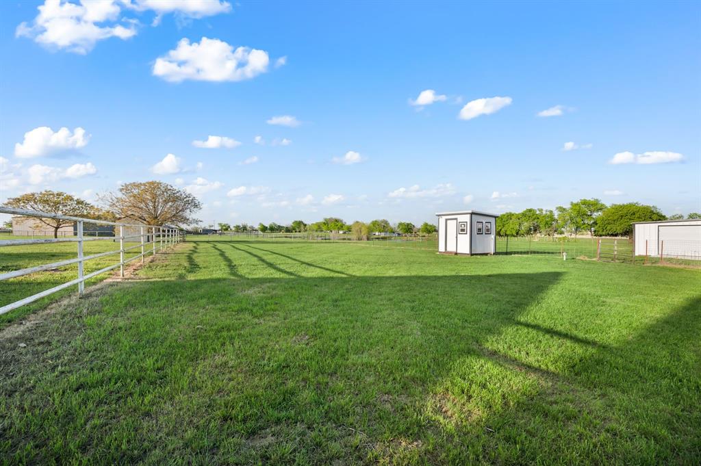 7384 Rector Road Sanger, TX 76266 - Photo 34 of 40 a view of a golf course with a lake