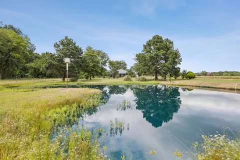 a view of a lake with a big yard