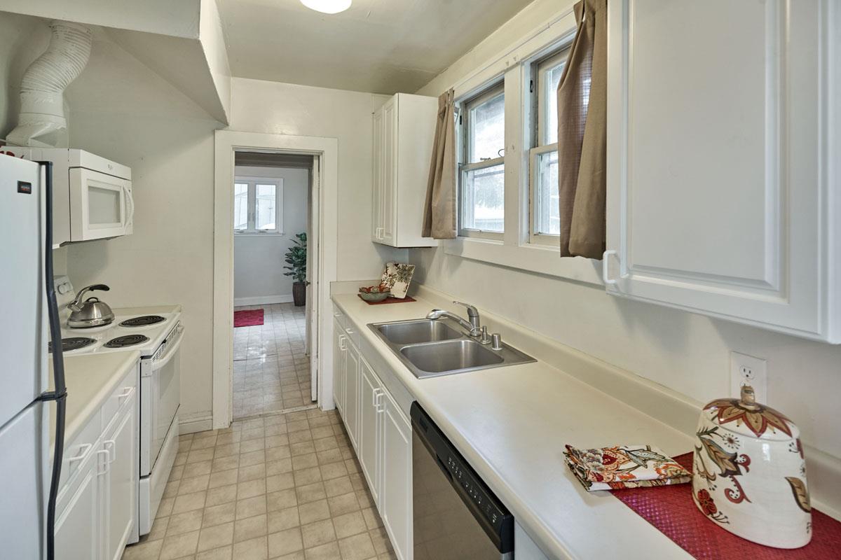 19000 Overlook Road Los Gatos, CA 95030 - Photo 14 of 25 a kitchen with a sink stove and cabinets
