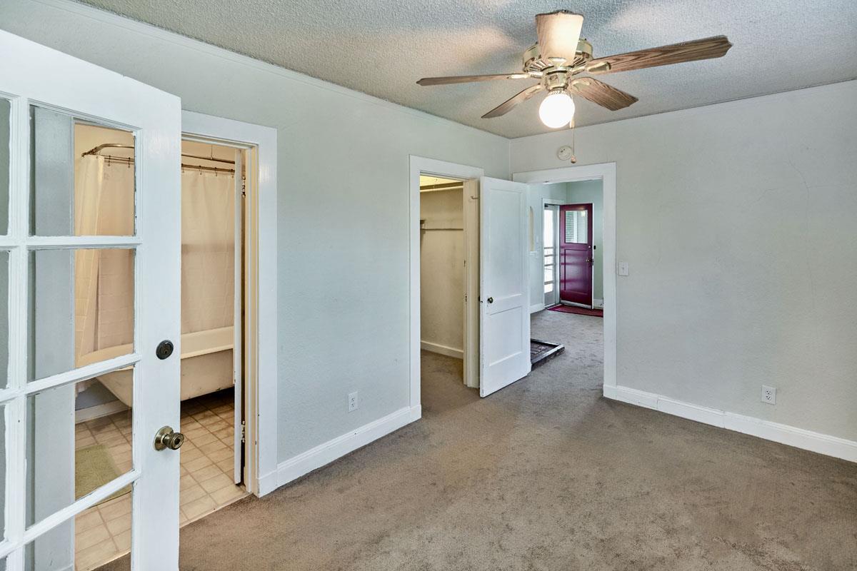 19000 Overlook Road Los Gatos, CA 95030 - Photo 17 of 25 a view of an empty room with a ceiling fan