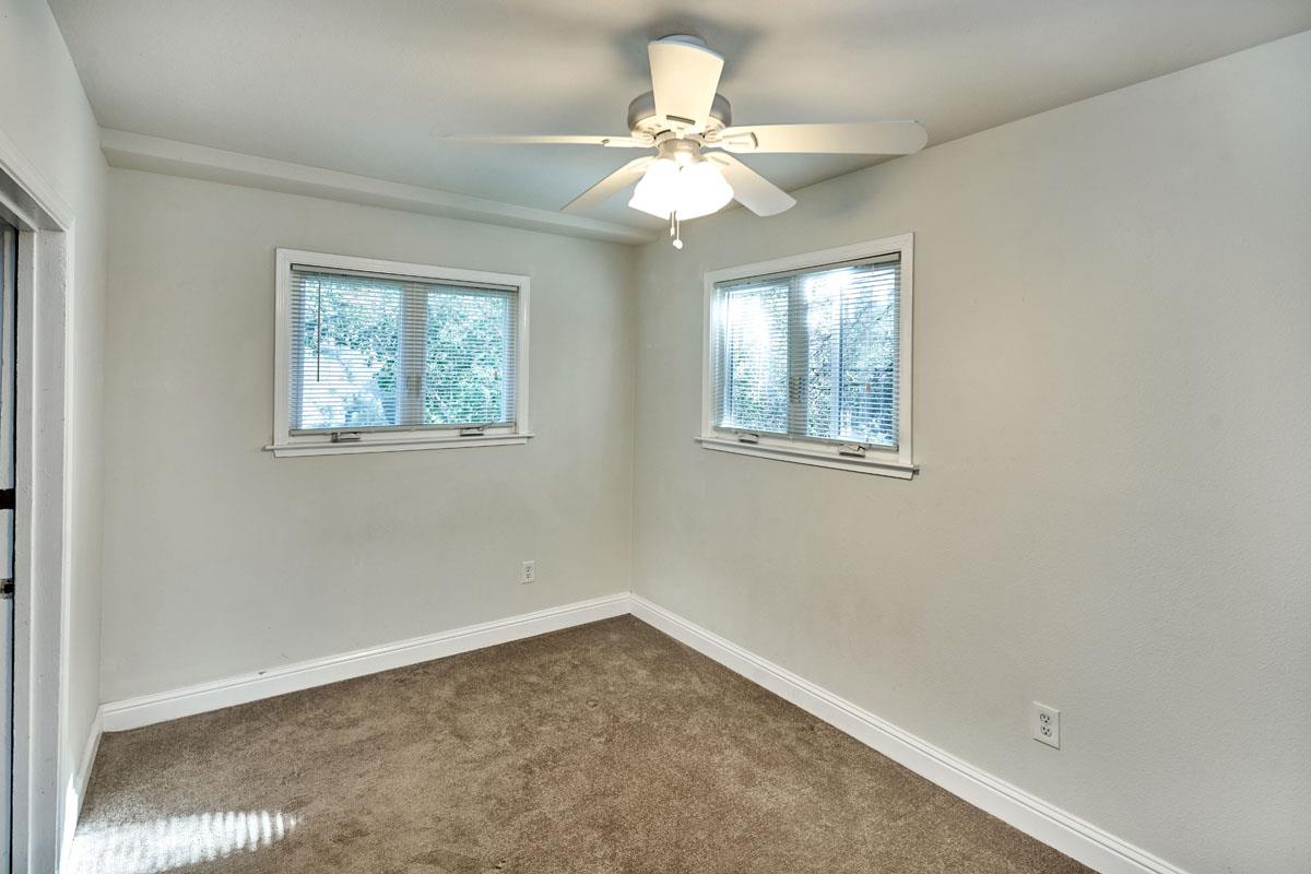 19000 Overlook Road Los Gatos, CA 95030 - Photo 21 of 25 an empty room with windows and fan