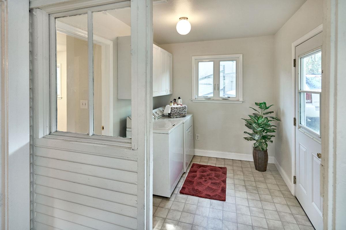 19000 Overlook Road Los Gatos, CA 95030 - Photo 25 of 25 a hallway with a dining table and chair