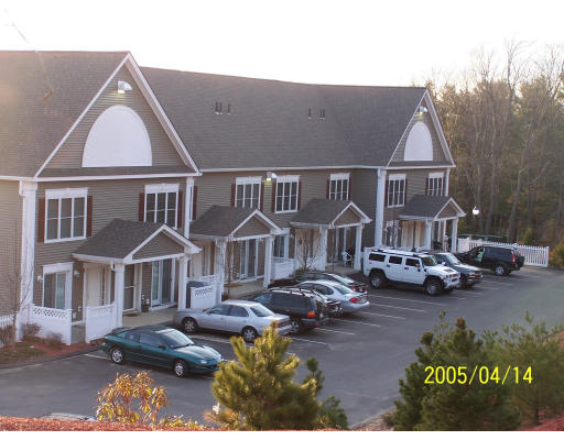 32-3 Pommogussett Road, Unit 3 Rutland, MA 01543 - Photo 1 of 1 a front view of a house with a yard
