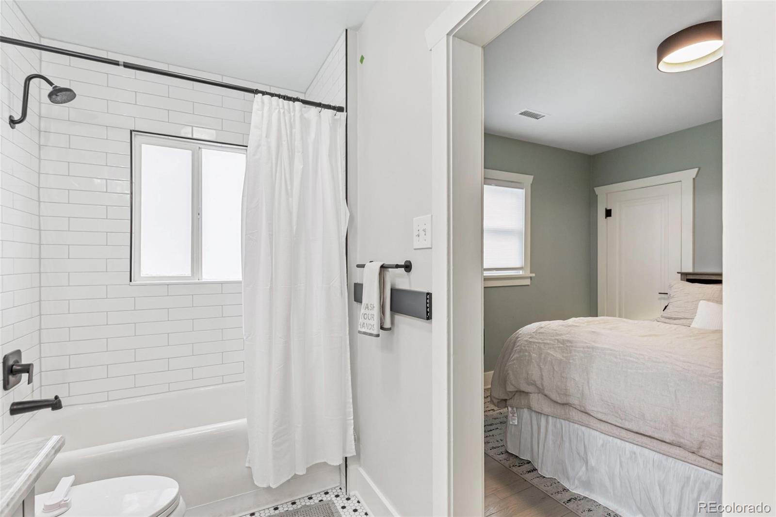 3612 Perry Street Denver, CO 80212 - Photo 18 of 50 a bathroom with a granite countertop sink toilet and shower